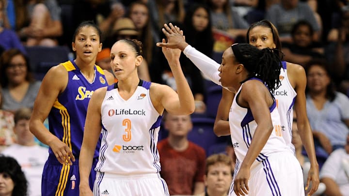 Sep 21, 2013; Phoenix, AZ, USA; Phoenix Mercury guard Diana Taurasi (3) is congratulated by teammate guard Alexis Hornbuckle (14) during the against the Los Angeles Sparks in the first half during Game 2 of a WNBA basketball Western Conference semifinal series at US Airways Center. Mandatory Credit: Jennifer Stewart-Imagn Images