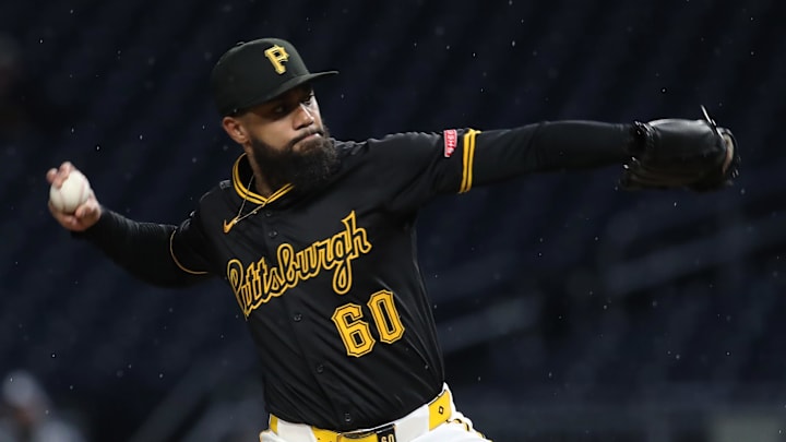 May 20, 2025; Pittsburgh, Pennsylvania, USA; Pittsburgh Pirates relief pitcher Dennis Santana (60) pitches against the Cincinnati Reds during the eighth inning at PNC Park. Mandatory Credit: Charles LeClaire-Imagn Images