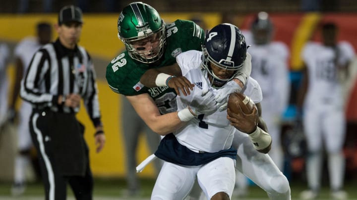 Eastern Michigan defensive lineman Maxx Crosby (92) sacks Georgia Southern quarterback Shai Werts (4) during the Camellia Bowl at Cramton Bowl in Montgomery, Ala., on Saturday, Dec. 15, 2018. Georgia Southern leads Eastern Michigan 17-7 at halftime. 

Jc Camellia 07
