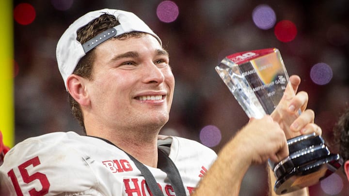 Indiana's Fernando Mendoza (15) holds the MVP trophy after the Indiana versus Ohio State Big Ten Championship football game at Lucas Oil Stadium on Saturday, Dec. 6, 2025.