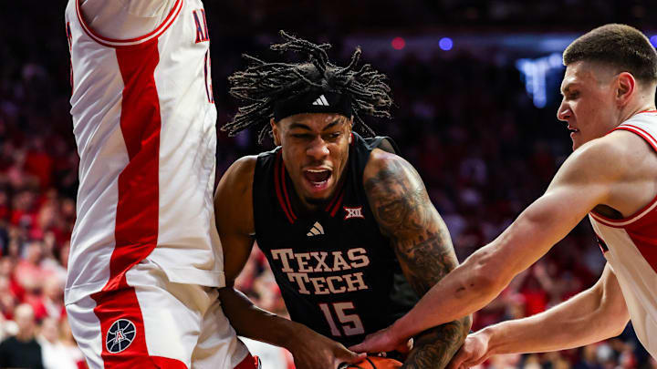 Feb 14, 2026; Tucson, Arizona, USA; Arizona Wildcats forward Ivan Kharchenkov (8) attempts to steal the ball from Texas Tech Red Raiders forward JT Toppin (15) during the first half of the game at McKale Memorial Center. Mandatory Credit: Aryanna Frank-Imagn Images
