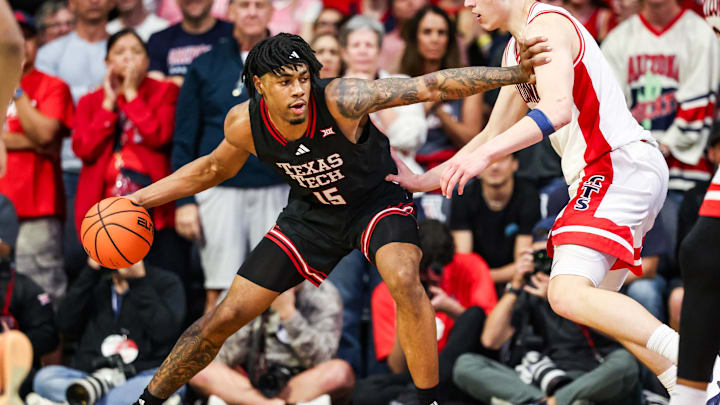 Feb 14, 2026; Tucson, Arizona, USA; Texas Tech Red Raiders forward JT Toppin (15) dribbles the ball against the Arizona Wildcats during overtime at McKale Memorial Center. Mandatory Credit: Aryanna Frank-Imagn Images Feb 14, 2026; Tucson, Arizona, USA; Texas Tech Red Raiders forward JT Toppin (15) dribbles the ball against the Arizona Wildcats during overtime at McKale Memorial Center. Mandatory Credit: Aryanna Frank-Imagn Images
