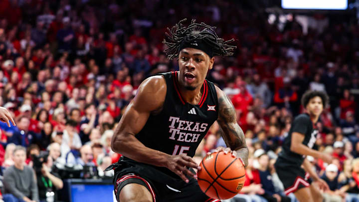 Feb 14, 2026; Tucson, Arizona, USA; Texas Tech Red Raiders forward JT Toppin (15) dribbles and dunks the ball during the first half of the game against the Arizona Wildcats at McKale Memorial Center. Mandatory Credit: Aryanna Frank-Imagn Images