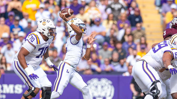 Tigers quarterback Jayden Daniels 5 throws a pass as the LSU Tigers take on Texas A&M in Tiger