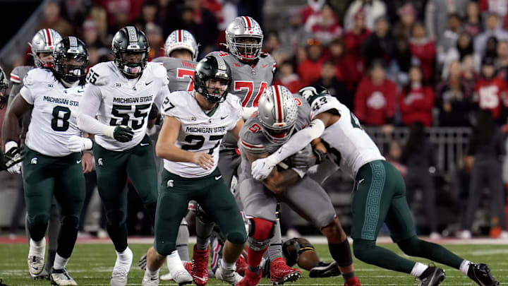 Nov 11, 2023; Columbus, Ohio, USA; Ohio State Buckeyes tight end Cade Stover (8) is tackled by Nov 11, 2023; Columbus, Ohio, USA; Ohio State Buckeyes tight end Cade Stover (8) is tackled by
