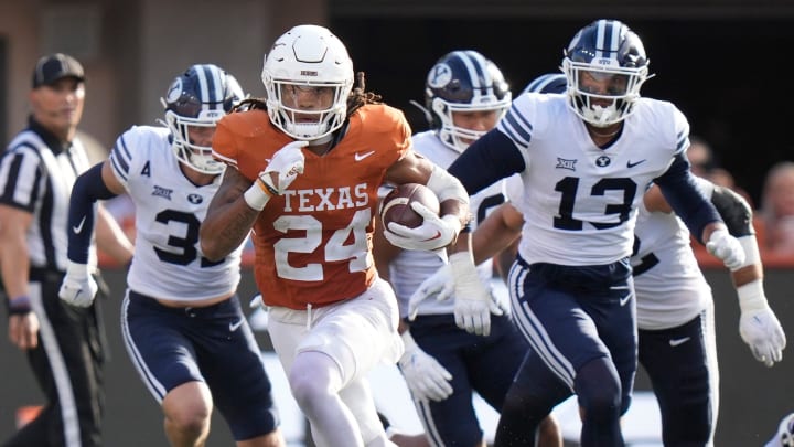 Texas Longhorns running back Jonathon Brooks runs past BYU Cougars defenders in the third quarter at Texas Longhorns running back Jonathon Brooks runs past BYU Cougars defenders in the third quarter at