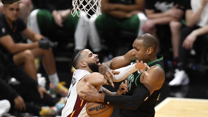 Apr 29, 2024; Miami, Florida, USA; Miami Heat forward Caleb Martin (16) and Boston Celtics center Al Horford - Michael Laughlin/USA TODAY Sports