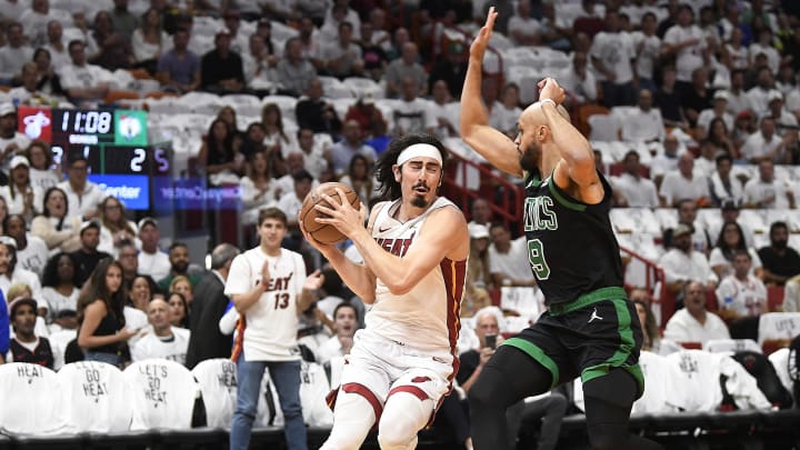 Apr 29, 2024; Miami, Florida, USA; Miami Heat guard Jaime Jaquez Jr. (11) drives on Boston Celtics guard Derrick White.
