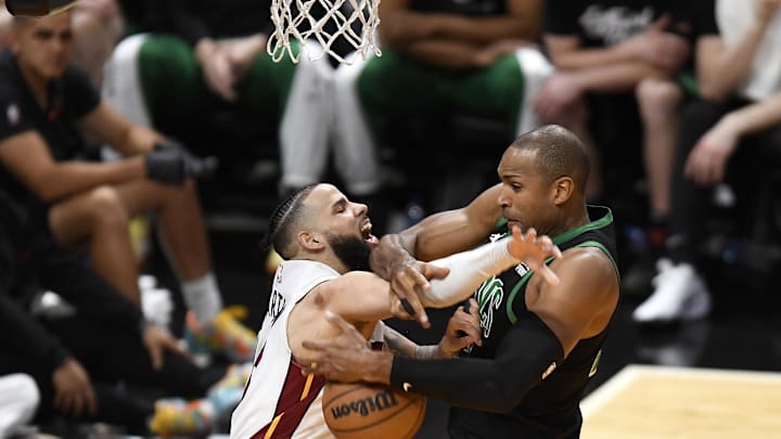 Apr 29, 2024; Miami, Florida, USA; Miami Heat forward Caleb Martin (16) and Boston Celtics center Al Horford - Michael Laughlin-USA TODAY Sports