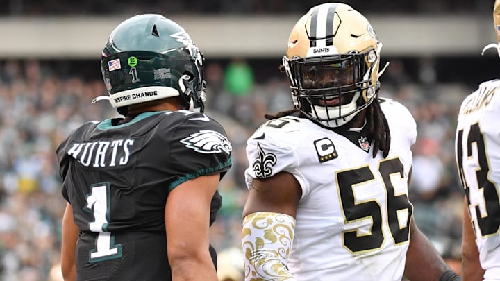 Nov 21, 2021; Philadelphia, Pennsylvania, USA; New Orleans Saints outside linebacker Demario Davis (56) smiles at Philadelphia Eagles quarterback Jalen Hurts (1) at Lincoln Financial Field. Mandatory Credit: Eric Hartline-Imagn Images