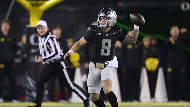 Nov 30, 2024; Eugene, Oregon, USA; Oregon Ducks quarterback Dillon Gabriel (8) throws a pass during the second half against the Washington Huskies at Autzen Stadium. Mandatory Credit: Troy Wayrynen-Imagn Images