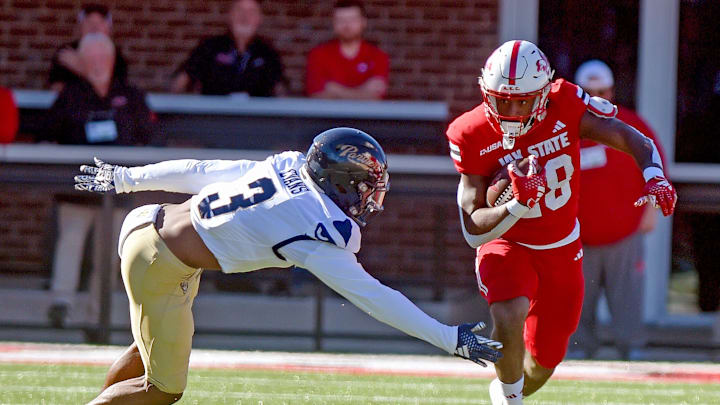 Jacksonville State's Tre Stewart tries to evade the tackle of FIU's JoJo Evans during college football action at AmFirst Stadium in Jacksonville, Alabama November 16, 2024. (Dave Hyatt / Hyatt Media LLC)