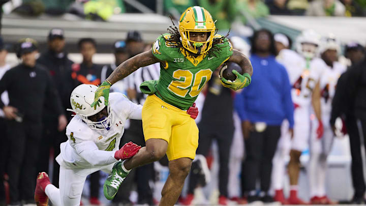 Nov 9, 2024; Eugene, Oregon, USA; Oregon Ducks running back Jordan James (20) picks up a first down on a pass play during the first half as he breaks away from Maryland Terrapins linebacker Ruben Hyppolite II (4) at Autzen Stadium. Mandatory Credit: Troy Wayrynen-Imagn Images