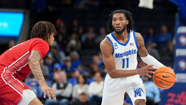 Memphis' Tyrese Hunter (11) looks to pass the ball during the game between Arkansas State University and the University of Memphis at FedExForum in Memphis, Tenn., on Sunday, December 8, 2024.