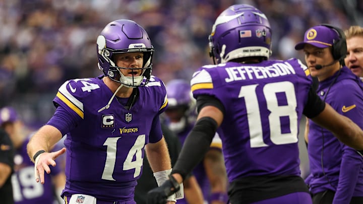 Minnesota Vikings quarterback Sam Darnold celebrates his touchdown pass to wide receiver Justin Jefferson. 