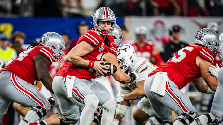 Jan 10, 2025; Arlington, TX, USA; Ohio State Buckeyes quarterback Will Howard (18) looks for a handoff in the second quarter as the Texas Longhorns play the Ohio State Buckeyes in the Cotton Bowl College Football Playoff semi-final at AT&T Stadium in Dallas, Texas. Mandatory Credit: Sara Diggins/USA TODAY Network via Imagn Images