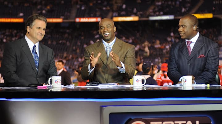 Steve Mariucci, Deion Sanders, and Marshall Faulk of the NFL Network at game between the Oakland Raiders and the San Diego Chargers at Qualcomm Stadium.
