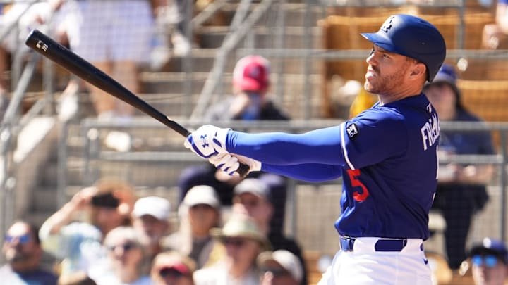 Freeman swinging the bat. 