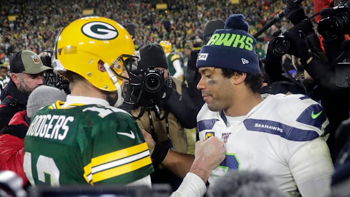 Former Green Bay Packers quarterback Aaron Rodgers and Seattle Seahawks quarterback Russell Wilson talk after a game in 2020.