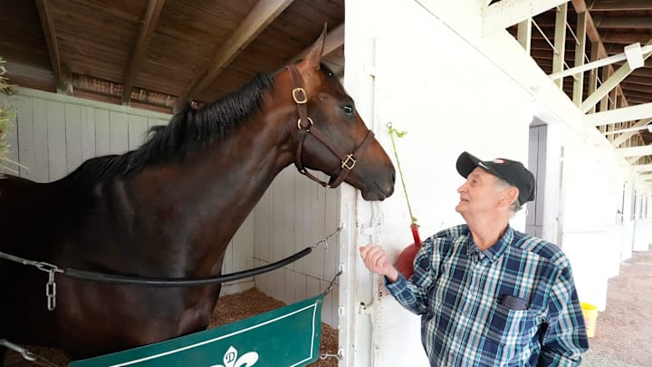 Wearing his trademark plaid shirt, Briley poses with Coal Battle—his $70,000 long shot colt and ticket to the sport’s biggest stage.