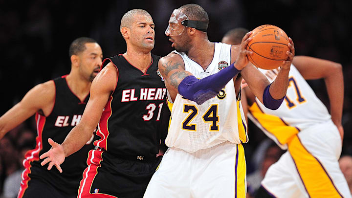 Los Angeles Lakers shooting guard Kobe Bryant controls the ball against the defense of Miami Heat small forward Shane Battier.