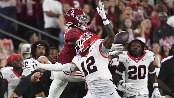 Sep 28, 2024; Tuscaloosa, Alabama, USA;  Alabama Crimson Tide wide receiver Ryan Williams (2) makes a catch behind Georgia Bulldogs defensive back Julian Humphrey (12) before running for a touchdown to put Alabama ahead in the fourth quarter at Bryant-Denny Stadium. Alabama defeated Georgia 41-34. Mandatory Credit: Gary Cosby Jr.-Imagn Images
