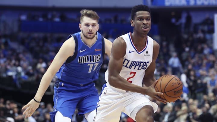 Jan 22, 2019; Dallas, TX, USA;vLA Clippers guard Shai Gilgeous-Alexander (2) looks to pass as Dallas Mavericks forward Luka Doncic (77) defends during the second half at American Airlines Center. Mandatory Credit: Kevin Jairaj-Imagn Images
