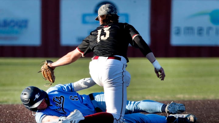 Riverdale's third baseman tags out a runner on third base during an Annual Warrior Spring Classic baseball game on Thursday, March 27, 2025, at Riverdale.