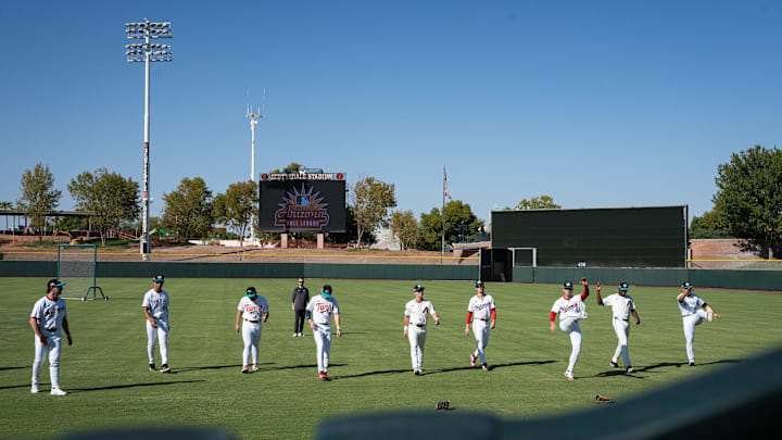 Players warm up for batting practice at Arizona Fall League media day at Scottsdale Stadium during media day on Oct. 4, 2024, in Scottsdale, Arizona.