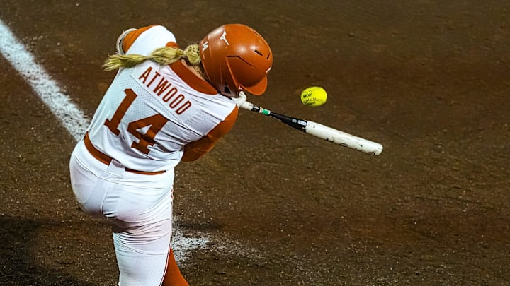 Texas Longhorns catcher Reese Atwood (14) swings at a pitch during the game against Texas Tech on day one of the Bevo Classic at Red and Charline McCombs Field on Friday, February 14, 2025, in Austin. Texas Longhorns catcher Reese Atwood (14) swings at a pitch during the game against Texas Tech on day one of the Bevo Classic at Red and Charline McCombs Field on Friday, February 14, 2025, in Austin.