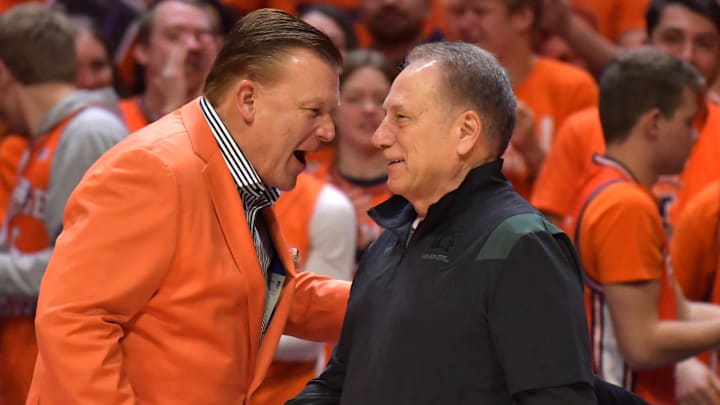Jan 13, 2023; Champaign, Illinois, USA;  Illinois Fighting Illini head coach Brad Underwood, left, shakes hands with Michigan State Spartans head coach Tom Izzo before the first half at State Farm Center. Mandatory Credit: Ron Johnson-Imagn Images