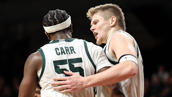 Dec 4, 2024; Minneapolis, Minnesota, USA; Michigan State Spartans forward Jaxon Kohler (0) and forward Coen Carr (55) celebrate during the second half against the Minnesota Golden Gophers at Williams Arena. Mandatory Credit: Matt Krohn-Imagn Images