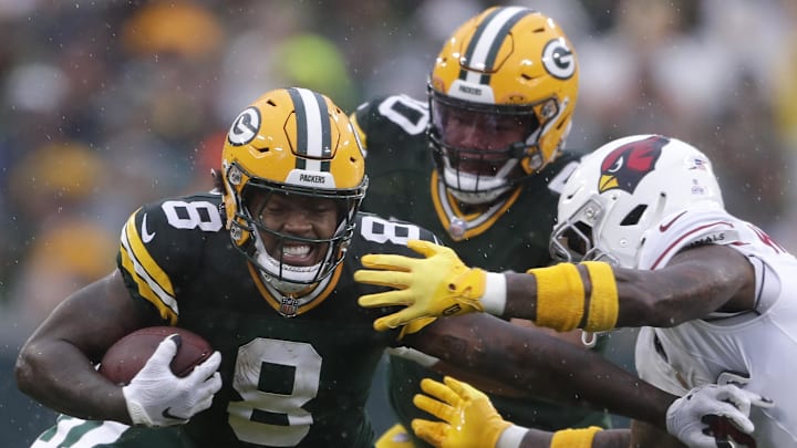Oct 13, 2024; Green Bay, Wisconsin, USA; Green Bay Packers running back Josh Jacobs (8) runs with the ball during the first half against the Arizona Cardinals at Lambeau Field. Mandatory Credit: Wm. Glasheen/USA TODAY Network via Imagn Images