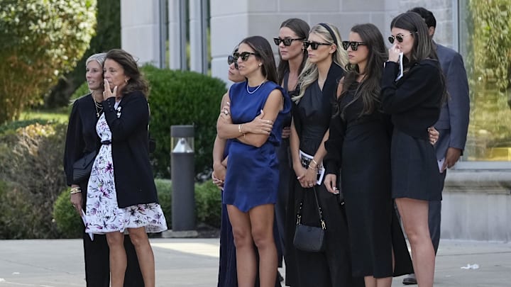 Jane Gaudreau, second from left, and Meredith Gaudreau, middle in blue, watch with friends and family as a hearse carries away the casket Johnny Gaudreau following his funeral at St. Mary Magdalen Parish. Johnny and Matthew Gaudreau died after being hit by a drunk driver while riding bicycles on Aug. 29. Jane Gaudreau, second from left, and Meredith Gaudreau, middle in blue, watch with friends and family as a hearse carries away the casket Johnny Gaudreau following his funeral at St. Mary Magdalen Parish. Johnny and Matthew Gaudreau died after being hit by a drunk driver while riding bicycles on Aug. 29.