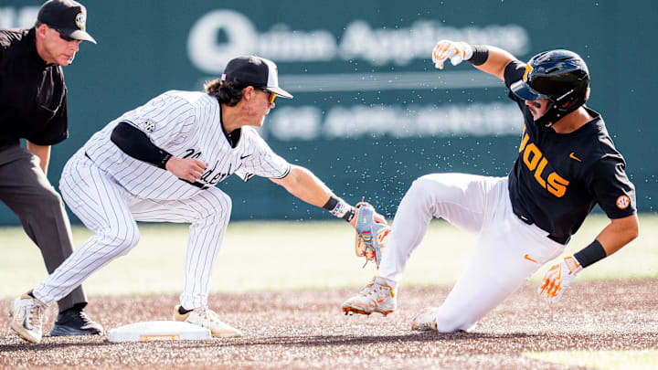 Vanderbilt's Rustan Rigdon (19) tags Tennessee's Hunter Ensley (9) out at second base during a college baseball game between Tennessee and Vanderbilt at Lindsey Nelson Stadium in Knoxville, Tenn., on May 9, 2025.
