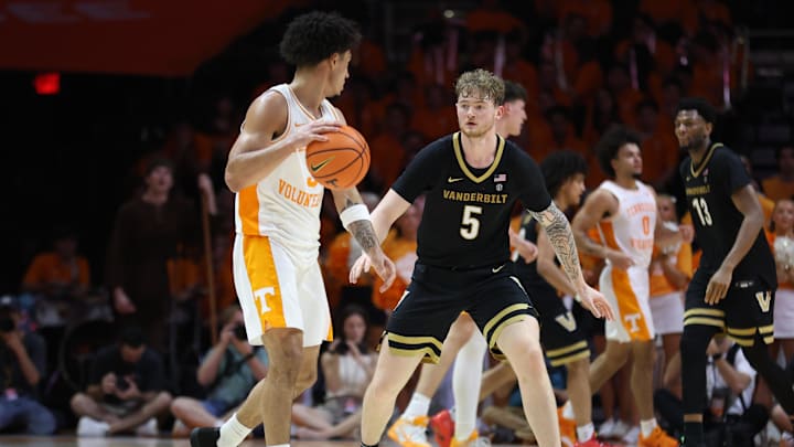 Mar 7, 2026; Knoxville, Tennessee, USA;  Tennessee Volunteers guard Bishop Boswell (3) is defended by Vanderbilt Commodores forward Tyler Nickel (5) during the second half at Thompson-Boling Arena at Food City Center. Mandatory Credit: Randy Sartin-Imagn Images