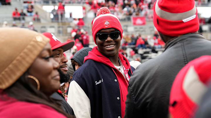 Providence Day School offensive tackle David Sanders Jr. talks to Maurice Clarett, left, prior to the NCAA football game between the Ohio State Buckeyes and the Indiana Hoosiers at Ohio Stadium in Columbus on Saturday, Nov. 23, 2024.