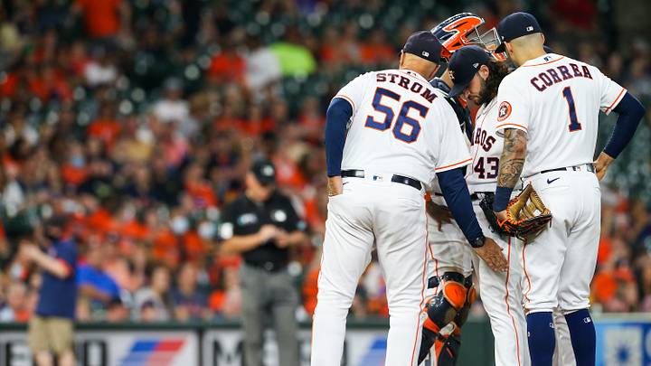 Sep 18, 2021; Houston, Texas, USA; Houston Astros pitching coach Brent Strom (56) taps starting pitcher Lance McCullers Jr. (43) on the leg after visiting the mound during their game against the Arizona Diamondbacks in the fourth inning at Minute Maid Park. Mandatory Credit: Thomas Shea-USA TODAY Sports