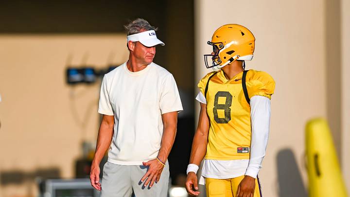 LSU Tigers head football coach Lane Kiffin talking with Quarterback Husan Longstreet 8 at LSU Football practice. August 18, 2026. LSU Tigers head football coach Lane Kiffin talking with Quarterback Husan Longstreet 8 at LSU Football practice. August 18, 2026.