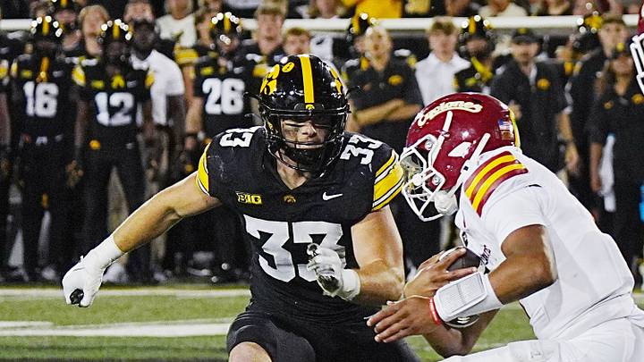 Iowa State quarterback Jaylen Raynor (1) battle for extra yard as getting tackle by Iowa Hawkeyes linebacker Cam Buffington (33) during the fourth quarter of the Cy-Hawk Series football game at Kinnick Stadium on Sept. 12, 2026, in Iowa City, Iowa. Iowa State quarterback Jaylen Raynor (1) battle for extra yard as getting tackle by Iowa Hawkeyes linebacker Cam Buffington (33) during the fourth quarter of the Cy-Hawk Series football game at Kinnick Stadium on Sept. 12, 2026, in Iowa City, Iowa.