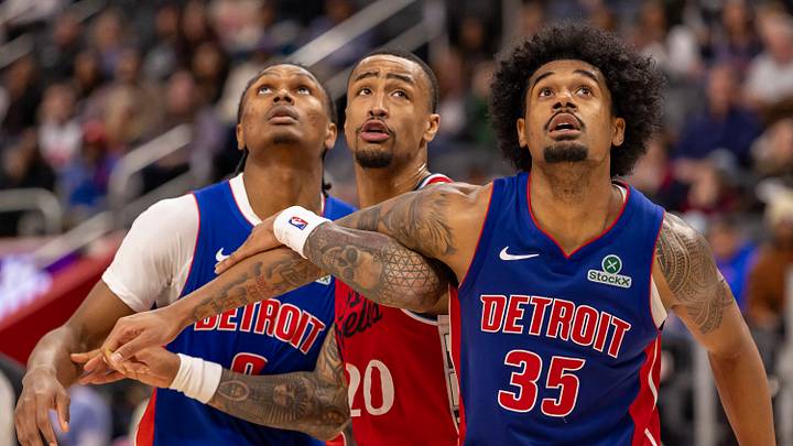 Jan 10, 2026; Detroit, Michigan, USA; LA Clippers forward John Collins (20) battles for position with Detroit Pistons guard Ausar Thompson (9) and forward Tolu Smith (35) during the second half at Little Caesars Arena. Mandatory Credit: David Reginek-Imagn Images