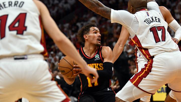 Apr 17, 2022; Miami, Florida, USA; Atlanta Hawks guard Trae Young (11) looks to pass the ball as Miami Heat forward P.J. Tucker (17) and teammate guard Tyler Herro (14) defend during the second half of game one of the first round for the 2022 NBA playoffs at FTX Arena. Mandatory Credit: Jim Rassol-USA TODAY Sports Apr 17, 2022; Miami, Florida, USA; Atlanta Hawks guard Trae Young (11) looks to pass the ball as Miami Heat forward P.J. Tucker (17) and teammate guard Tyler Herro (14) defend during the second half of game one of the first round for the 2022 NBA playoffs at FTX Arena. Mandatory Credit: Jim Rassol-USA TODAY Sports