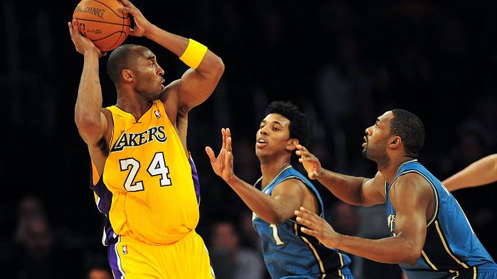 December 7, 2010; Los Angeles, CA, USA; Los Angeles Lakers shooting guard Kobe Bryant (24) passes the ball against the defense of Washington Wizards shooting guard Nick Young (1) and point guard Gilbert Arenas (9) during the firsthalf at the Staples Center. Mandatory Credit: Gary A. Vasquez-USA TODAY Sports December 7, 2010; Los Angeles, CA, USA; Los Angeles Lakers shooting guard Kobe Bryant (24) passes the ball against the defense of Washington Wizards shooting guard Nick Young (1) and point guard Gilbert Arenas (9) during the firsthalf at the Staples Center. Mandatory Credit: Gary A. Vasquez-USA TODAY Sports