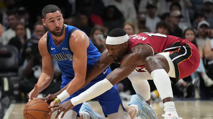 Nov 24, 2025; Miami, Florida, USA; Dallas Mavericks guard Klay Thompson (31) and Miami Heat center Bam Adebayo (13) battle for a loose ball during the second half at Kaseya Center. Nov 24, 2025; Miami, Florida, USA; Dallas Mavericks guard Klay Thompson (31) and Miami Heat center Bam Adebayo (13) battle for a loose ball during the second half at Kaseya Center.