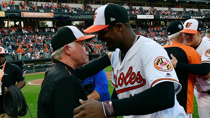 Sep 30, 2018; Baltimore, MD, USA; Baltimore Orioles right fielder Adam Jones (10) hugs manager Buck Showalter (26) coming off the field after the game against the Houston Astros at Oriole Park at Camden Yards. Mandatory Credit: Tommy Gilligan-USA TODAY Sports