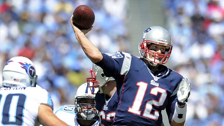 New England Patriots quarterback Tom Brady (12) throws a touchdown pass over the Tennessee Titans defense at LP Field in Nashville on Sept. 9, 2012. The Titans lost their home and season opener 34-13. New England Patriots quarterback Tom Brady (12) throws a touchdown pass over the Tennessee Titans defense at LP Field in Nashville on Sept. 9, 2012. The Titans lost their home and season opener 34-13.