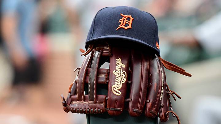 A detailed view of a Detroit Tigers hat and glove. A detailed view of a Detroit Tigers hat and glove.
