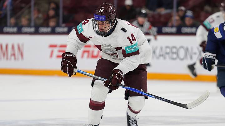MINNEAPOLIS, MN - DECEMBER 28: Oliver Murnieks #14 of Latvia skates without the puck during the Preliminary Round - Group B, Game 10 Finland vs Latvia - 2026 IIHF World Junior Championship between Finland and Latvia at 3M Arena at Mariucci on December 28, 2025 in Minneapolis, Minnesota. (Photo by Michael Miller/ISI Photos/ISI Photos via Getty Images)