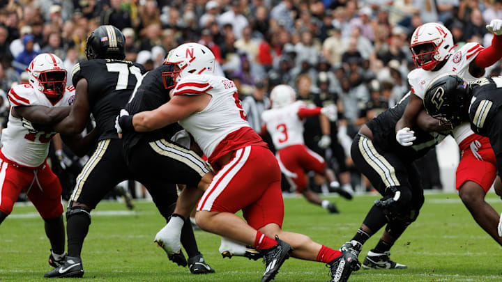 Nebraska defensive lineman Ty Robinson sacks Purdue quarterback Hudson Card. Nebraska defensive lineman Ty Robinson sacks Purdue quarterback Hudson Card.