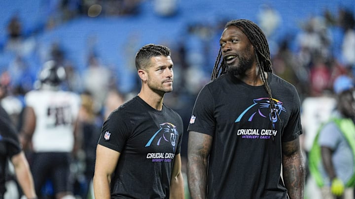 Oct 13, 2024; Charlotte, North Carolina, USA; Carolina Panthers head coach Dave Canales talks with linebacker Jadeveon Clowney (7) after the second half against the Atlanta Falcons at Bank of America Stadium. 